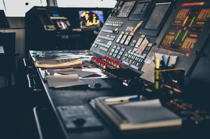 Ship bridge console with control panels and displays